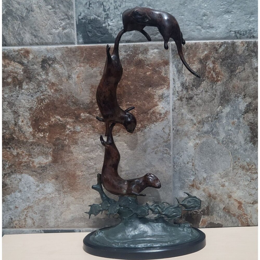 Three Bronze Otters Diving Over Fish Rusty on Wood Base Animal Sculpture
